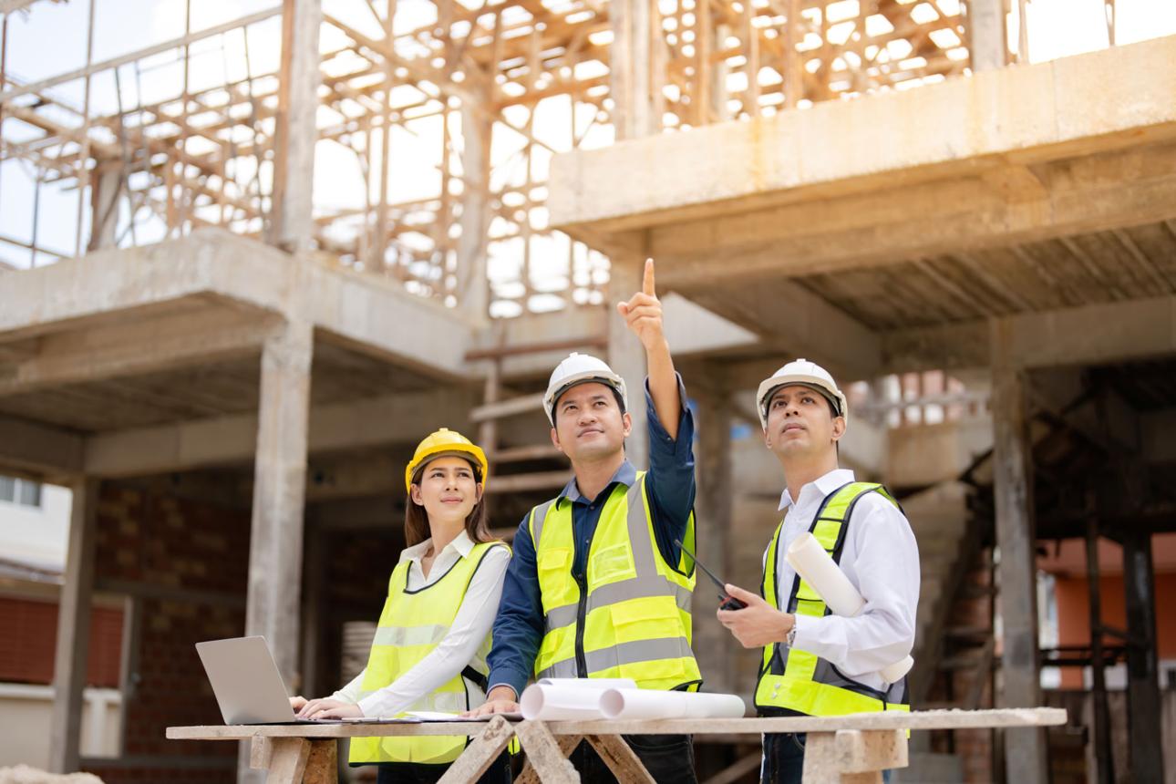 AAA Builders site team reviewing plans